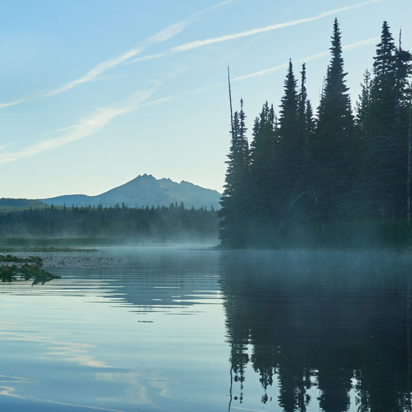 Scenic view of river and mountains against Sky.