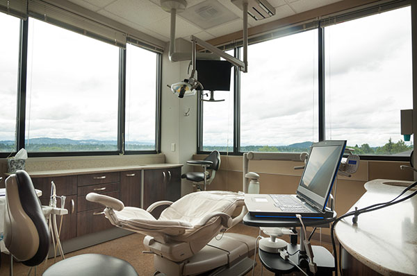 Dental exam room with dental exam chair at Fusion Dental Specialists in Happy Valley, OR.