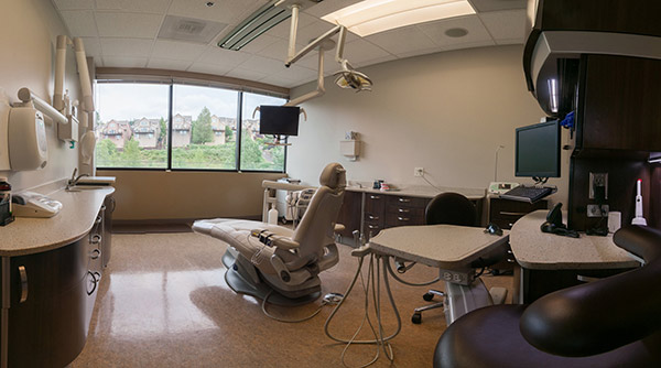 Dental chair in exam room  at Fusion Dental Specialists in Happy Valley, OR.