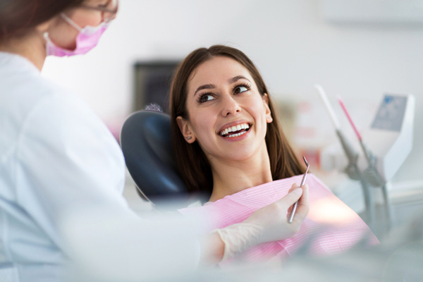 Woman smiling in a dental chair