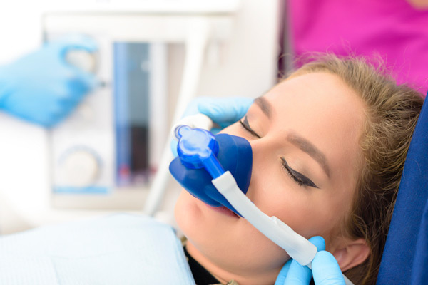 Sedated woman in dental chair, at Fusion Dental Specialists in Happy Valley, OR.